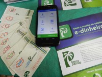 A plataforma E-Dinheiro é um meio de pagamento digital e funciona nacionalmente. Também é possível fazer resgates em reais (Foto: Divulgação)